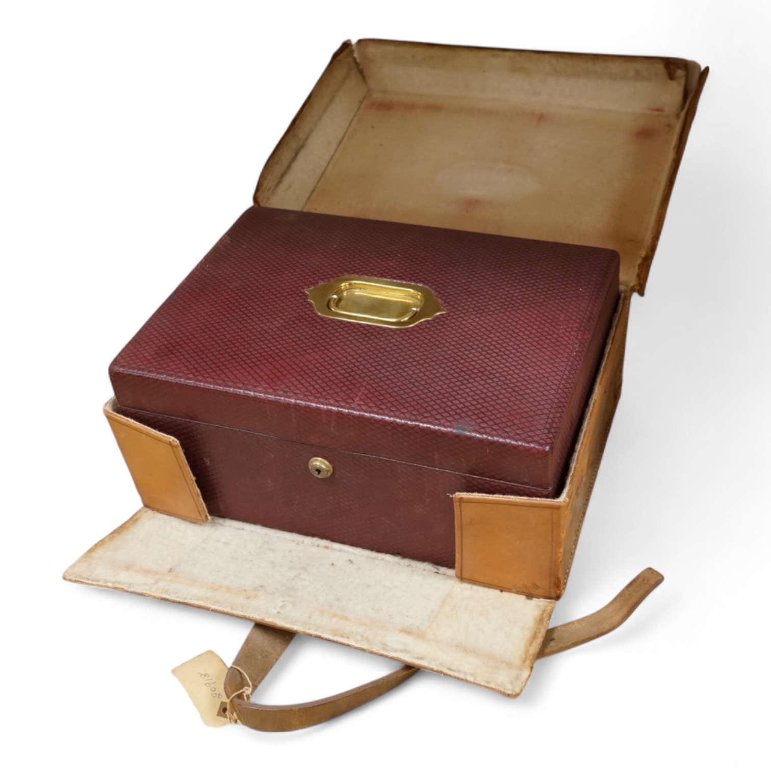 A cased travelling lock box with Bramah lock and leather case, no key, 36cm high